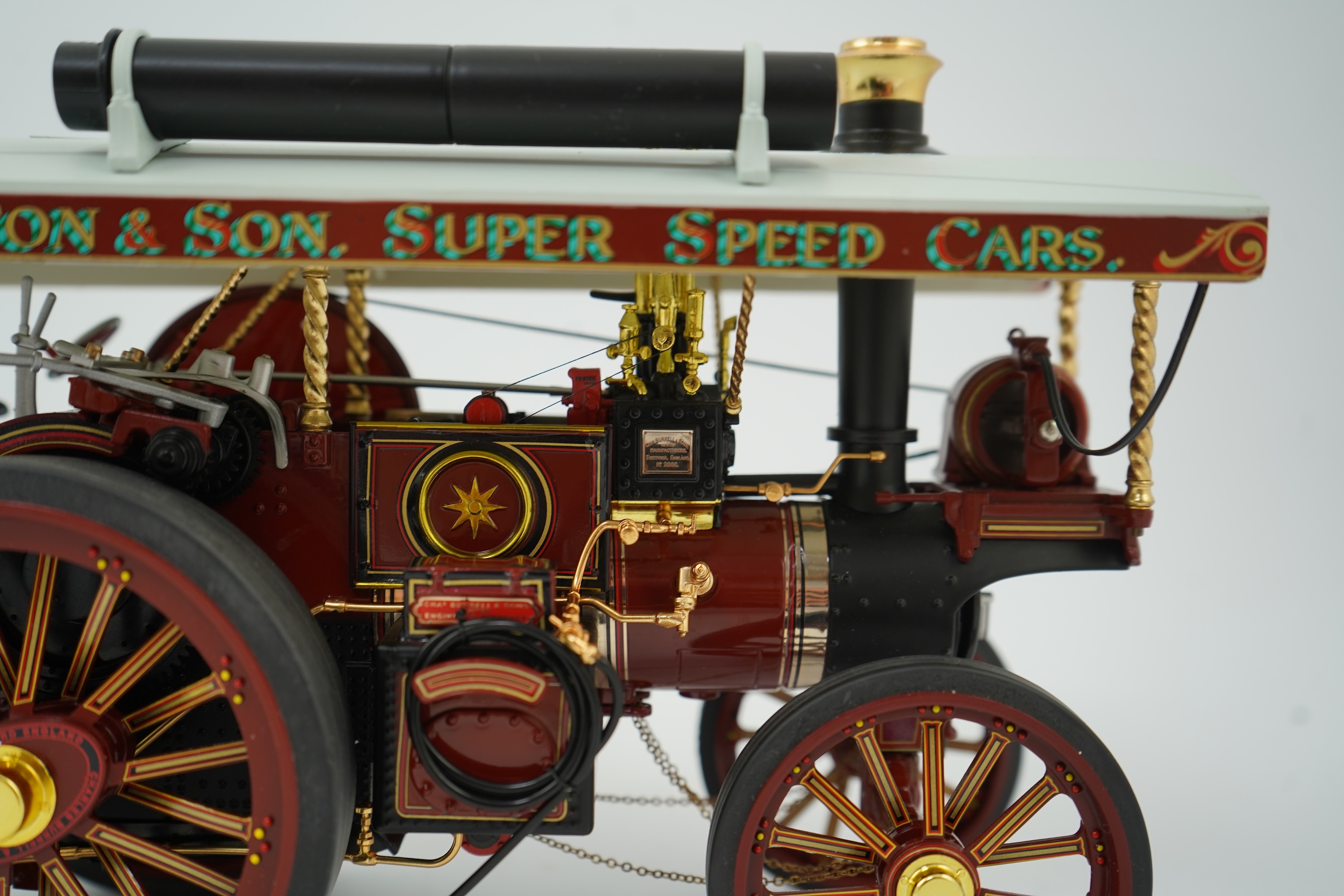 A Midsummer Models Ltd. 1:24 scale model of a Burrell Showman’s Engine, Britannia, in William Thurston and Son. Super Speed Cars livery, missing the original card box, but with an oak and Perspex display case